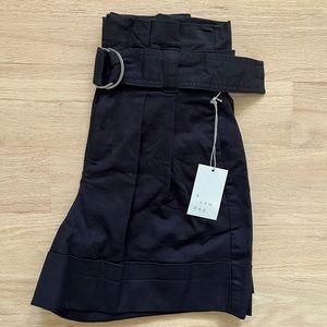 Black pleated shorts. New with tags. Size 2.